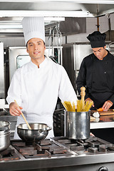 Image showing Happy Chef Cooking Food