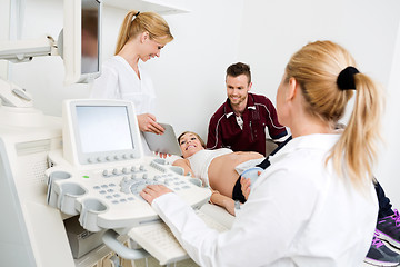 Image showing Doctor Showing Digital Tablet To Expectant Couple