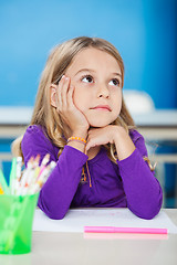 Image showing Girl With Hand On Chin Looking Away In Class