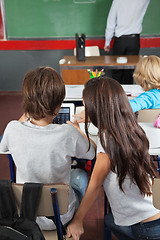 Image showing Schoolchildren Using Digital Tablet In Classroom