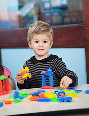 Image showing Boy Playing With Blocks In Kindergarten