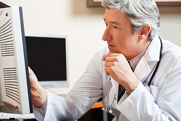 Image showing Doctor Looking At Computer Screen