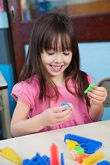 Image showing Girl Playing With Construction Blocks In Classroom