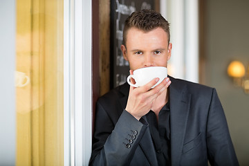 Image showing Young Businessman Drinking Coffee