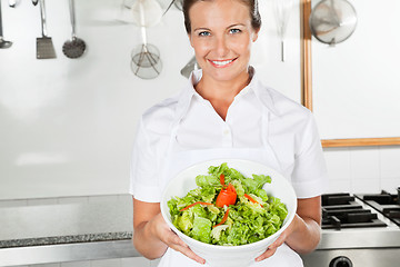 Image showing Female Chef Presenting Bowl Of Salad