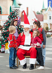 Image showing Happy Children With Santa Claus