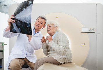 Image showing Doctor And Patient Looking At CT Scan X-ray