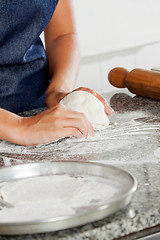 Image showing Female Chef Kneading Dough