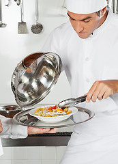 Image showing Chef Checking Pasta Dish With Tong