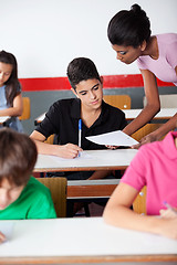 Image showing Teacher Showing Paper To University Student