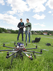 Image showing UAV Helicopter And Technicians At Park