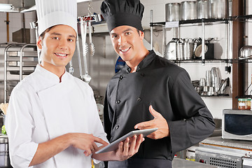 Image showing Happy Chefs Holding Digital Tablet
