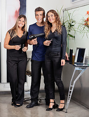 Image showing Confident Hairstyling Team At Salon