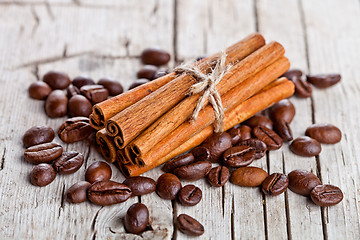Image showing stack of cinnamon sticks and coffee beans