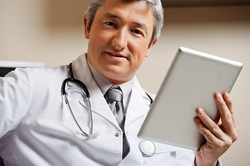Image showing Male Doctor Holding Digital Tablet