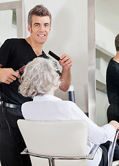 Image showing Hairstylist Curling Client's Hair