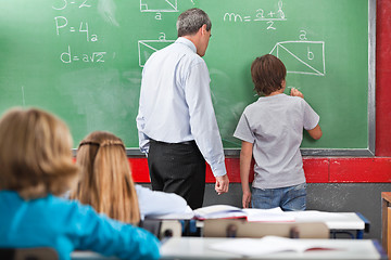 Image showing Schoolboy Solving Mathematics