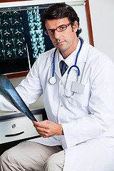 Image showing Radiologist Holding X-ray