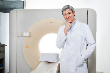 Image showing Doctor Standing By Ct Scan Machine