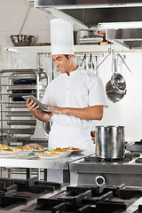 Image showing Happy Chef Using Digital Tablet In Kitchen