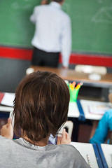 Image showing Closeup Of Little Boy Sitting In Classroom