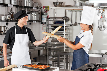 Image showing Chefs Fighting With Bread Loafs