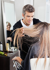 Image showing Hairdresser Attending Customer In Hair Salon