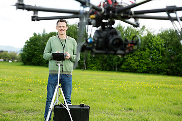 Image showing Happy Engineer Operating UAV in Park