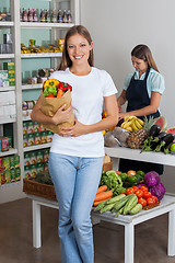 Image showing Woman Holding Grocery Bag At Grocery Store