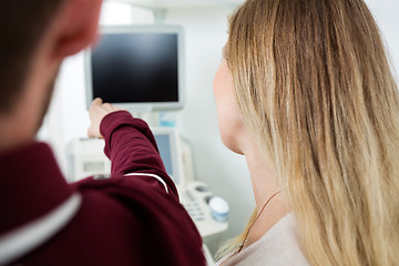 Image showing Man Showing Ultrasound Machine To Woman