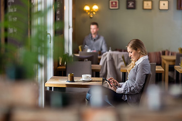 Image showing Pregnant Woman Using Digital Tablet At Cafe