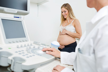 Image showing Pregnant Woman With Obstetrician In Clinic
