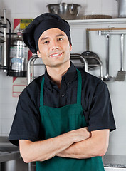 Image showing Chef With Hands Folded Standing In Kitchen