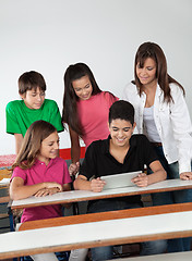 Image showing Students Using Digital Tablet At Desk