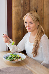 Image showing Young Woman With Plate Of Salad In Restaurant