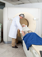 Image showing Doctor Preparing Woman For CT Scan Test