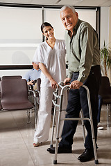 Image showing Female Nurse Helping Senior Patient With Walker