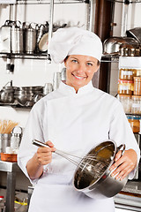 Image showing Female Chef With Wire Whisk And Mixing Bowl