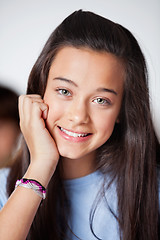 Image showing Beautiful Teenage Schoolgirl In Smiling Classroom