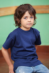 Image showing Cute Little Boy Sitting In Classroom