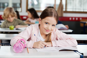 Image showing Portrait Of Schoolgirl Drawing In Book