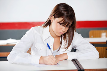 Image showing Teenage Schoolgirl Writing During Examination