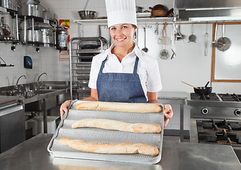 Image showing Female Chef Presenting Baked Breads