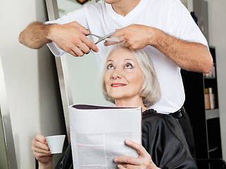 Image showing Senior Woman Having Haircut At Salon