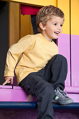 Image showing Little Boy Playing At Playhouse