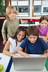 Image showing Schoolchildren Using Laptop At Desk