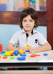 Image showing Little Boy With Construction Blocks Playing In Class