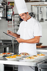 Image showing Young Chef With Clipboard At Kitchen