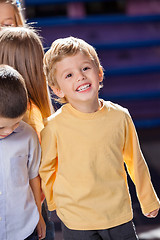 Image showing Boy Looking Away With Friends In Kindergarten