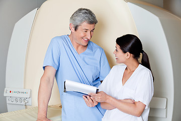 Image showing Radiologic Technicians Smiling At Each Other